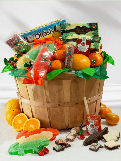 Fruit Basket including oranges, grapefruit, gummies and assorted chocolate candies in a Florida grove basket.