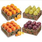 Four decorative boxes filled with oranges, pears, and apples for gift giving.