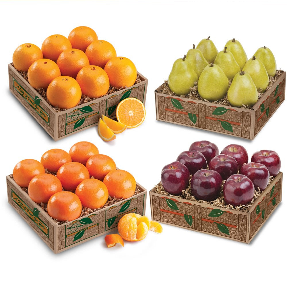 Four decorative boxes filled with oranges, pears, and apples for gift giving.