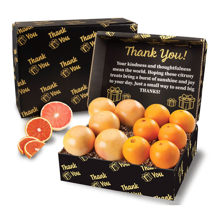 Box of scarlet red oranges and red grapefruit with 'Thank You!' message on a white background