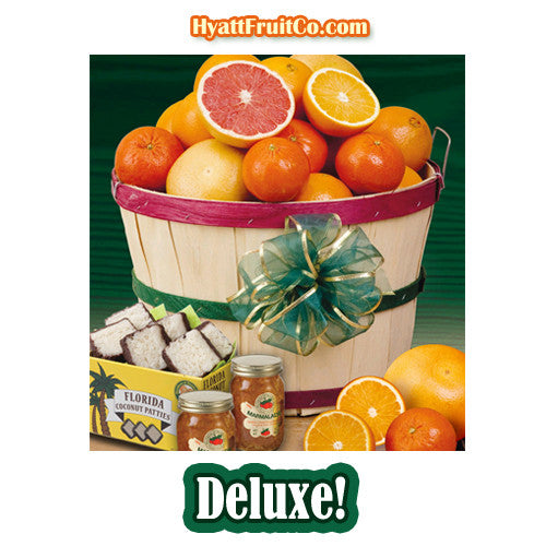 Florida Fruit Gift Basket shown with Deluxe items including chocolate-covered coconut patties and orange marmalade.