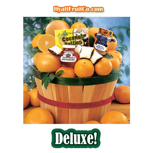 Grove Basket gift overflowing with oranges, grapefruit, chocolate-covered coconut patties and orange marmalade.